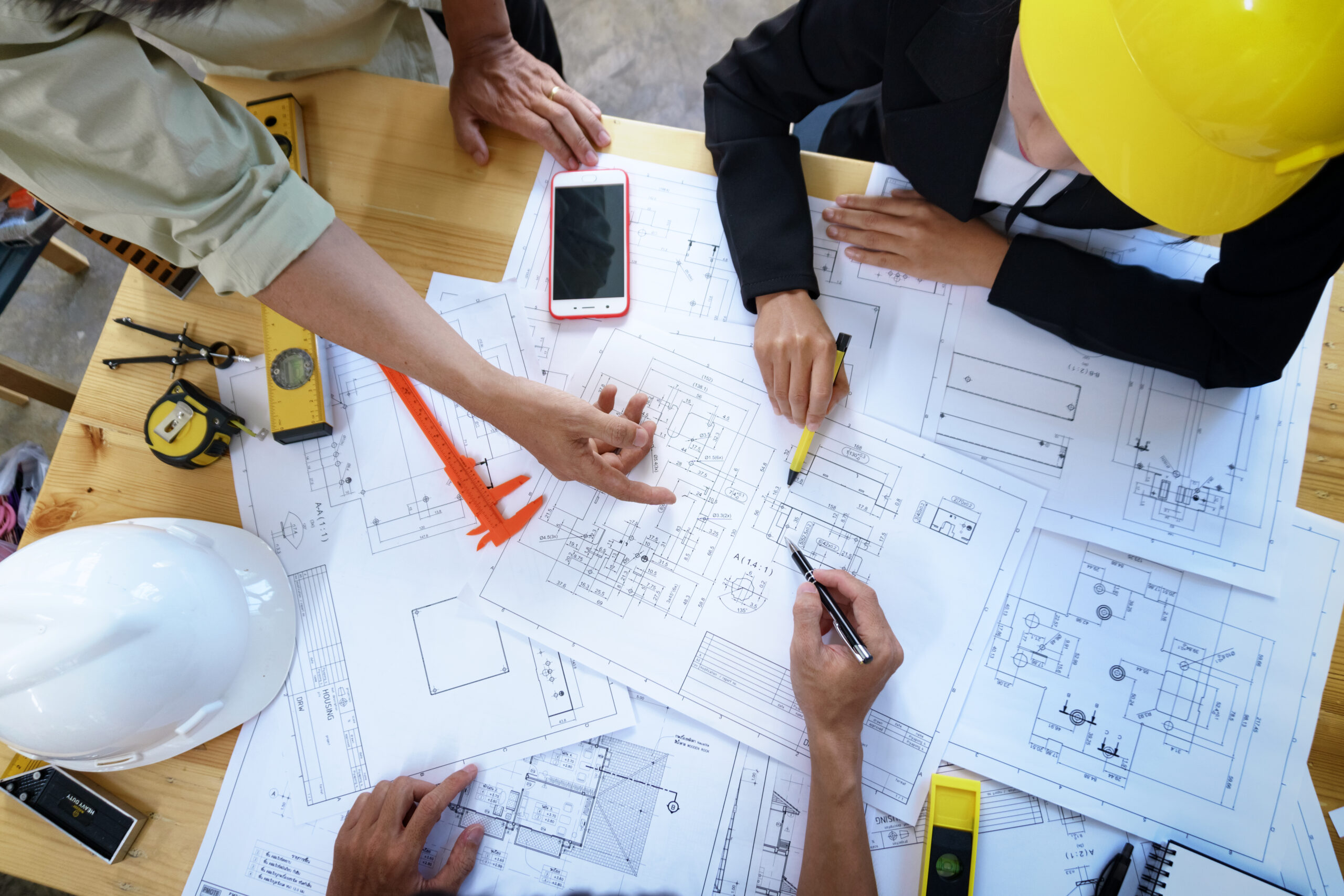Engineer,People,Meeting,Working,And,Pointing,At,A,Drawings,In Engineer,People,Meeting,Working,And,Pointing,At,A,Drawings,In
